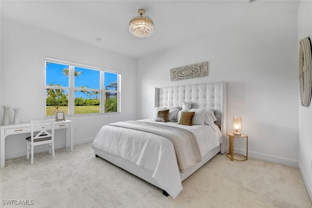 bedroom featuring light colored carpet