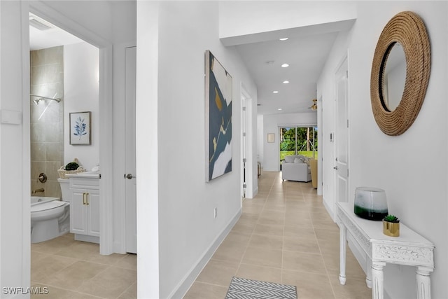 corridor featuring light tile patterned floors