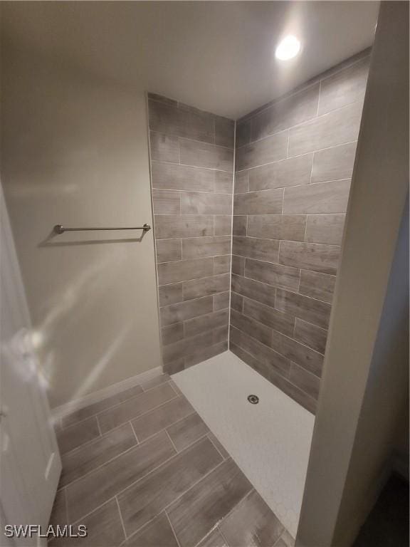 bathroom with a tile shower