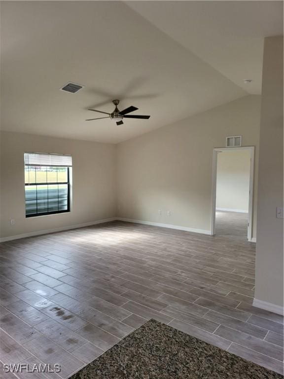 spare room with ceiling fan and vaulted ceiling