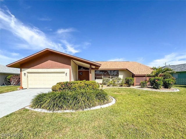 ranch-style house featuring a front lawn and a garage