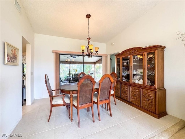 dining area featuring an inviting chandelier and light tile patterned flooring