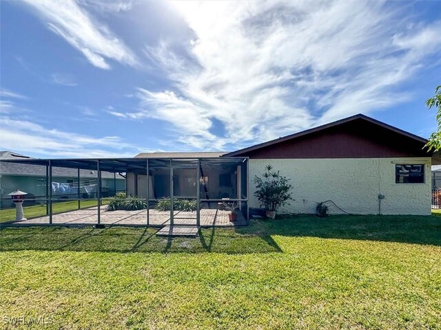 back of property featuring a yard and a patio