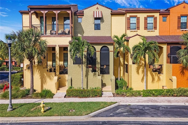 mediterranean / spanish house with a balcony