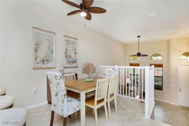 dining space with ceiling fan and light tile patterned floors