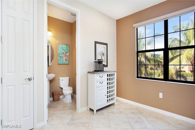 bathroom with tile patterned floors and toilet