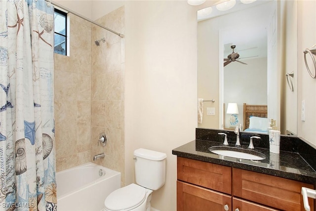 full bathroom featuring ceiling fan, toilet, vanity, and shower / tub combo