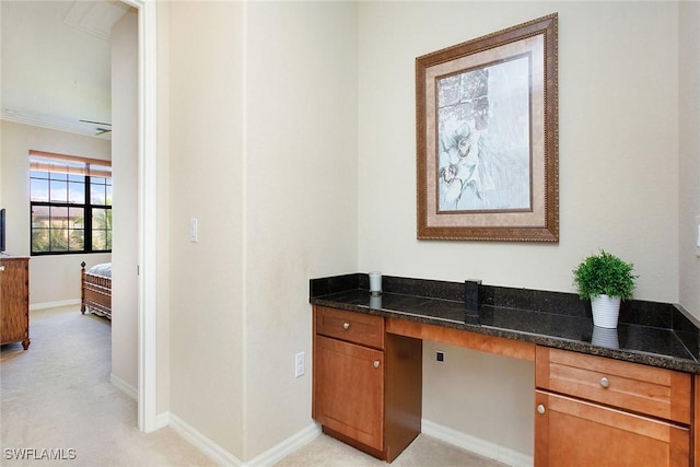 office featuring light carpet and built in desk