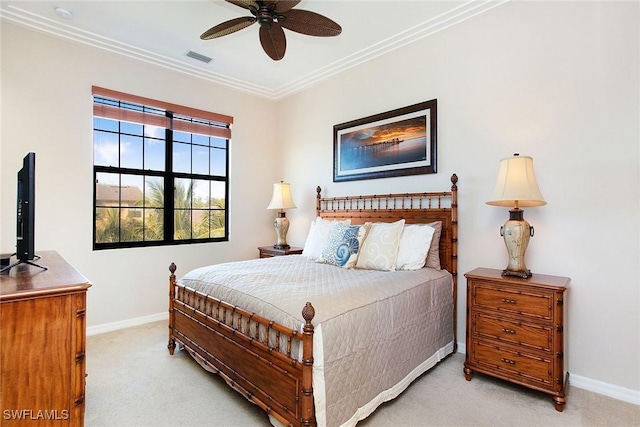 bedroom featuring ceiling fan, light colored carpet, and ornamental molding