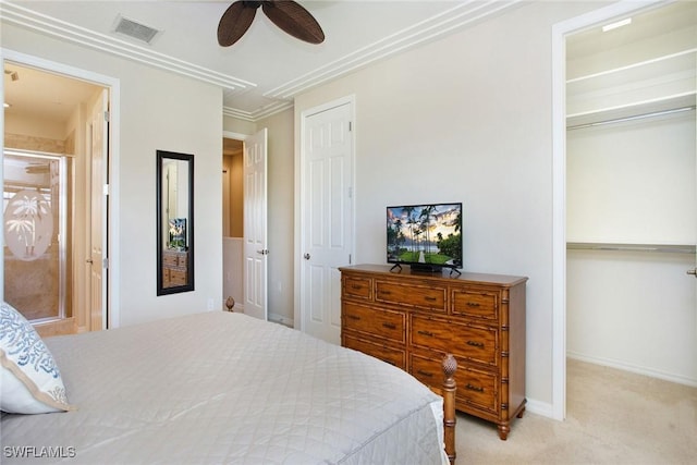 carpeted bedroom with ceiling fan and crown molding