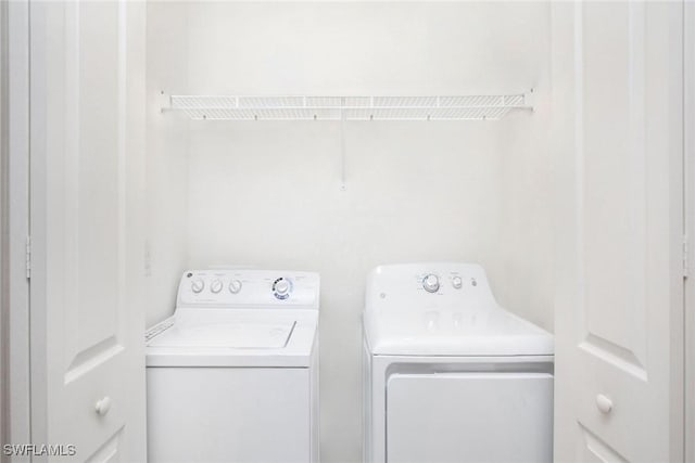 washroom featuring separate washer and dryer