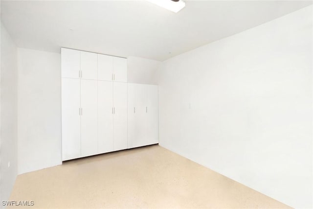 unfurnished bedroom featuring a closet