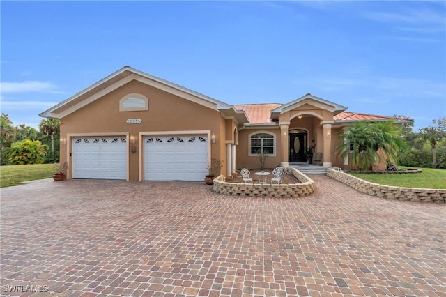 single story home featuring a garage