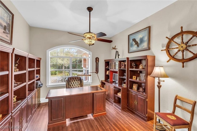 office space with dark hardwood / wood-style floors and ceiling fan