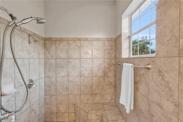 bathroom with a tile shower