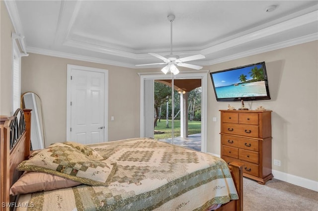 carpeted bedroom with access to outside, a raised ceiling, ceiling fan, and ornamental molding