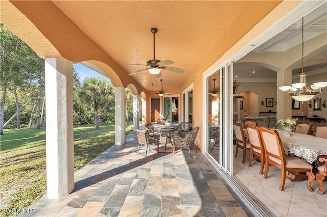 view of patio featuring ceiling fan