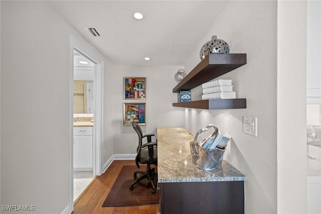 office space with light hardwood / wood-style flooring