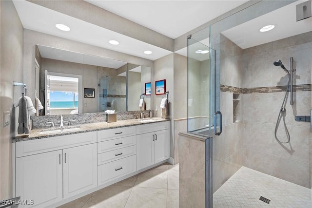 bathroom featuring vanity and an enclosed shower