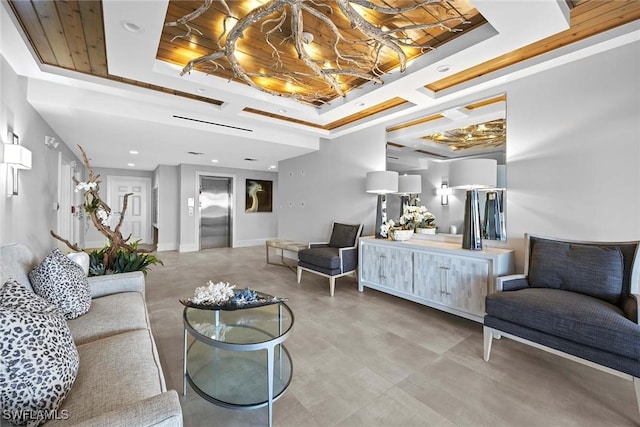 living room featuring crown molding, elevator, and a tray ceiling