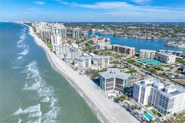 drone / aerial view featuring a beach view and a water view