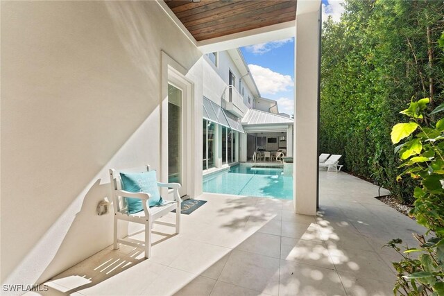 view of pool featuring a patio area