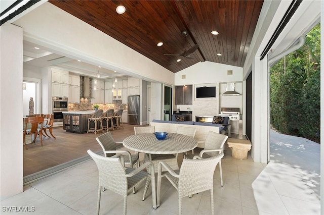 dining space featuring recessed lighting, wood ceiling, light tile patterned flooring, and vaulted ceiling