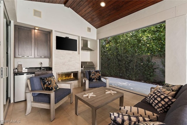 living room featuring a fireplace, light tile patterned floors, lofted ceiling, visible vents, and wooden ceiling