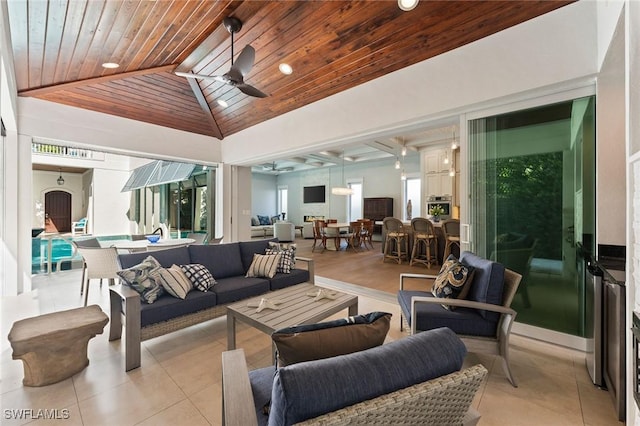 view of patio / terrace with outdoor dining area, ceiling fan, and an outdoor hangout area