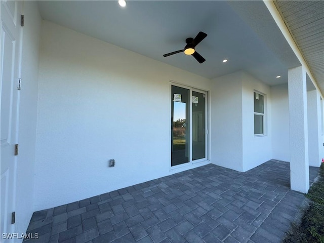 view of patio / terrace featuring ceiling fan