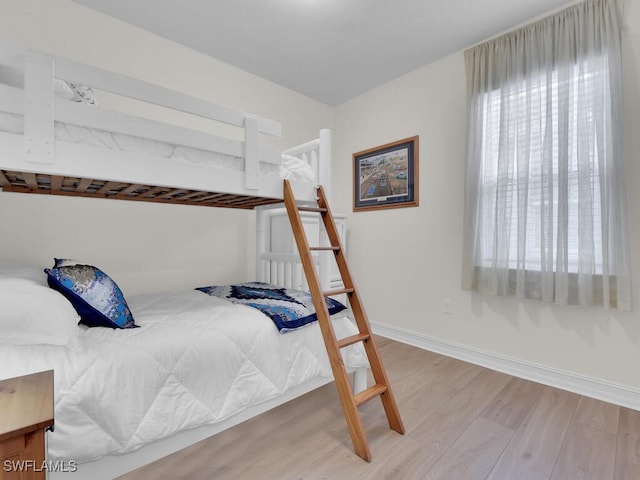 bedroom with wood-type flooring