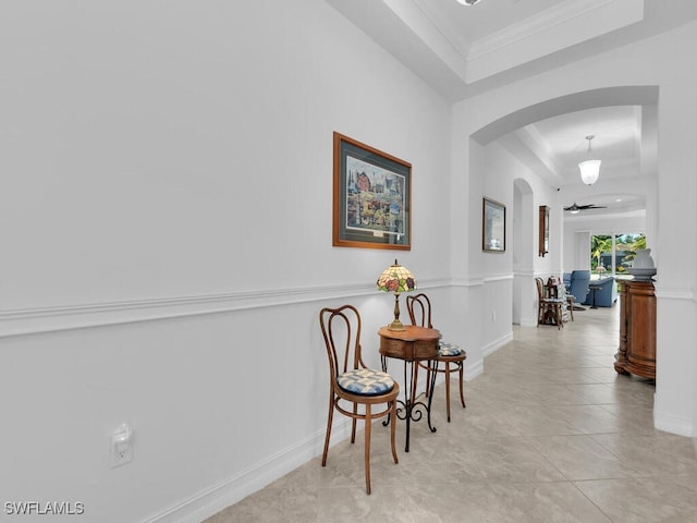 15271 Torino Ln, Fort Myers, FL 33908 - hall with a raised ceiling, arched walkways, ornamental molding, and baseboards