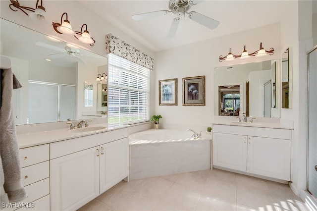 bathroom with tile patterned floors, vanity, and independent shower and bath