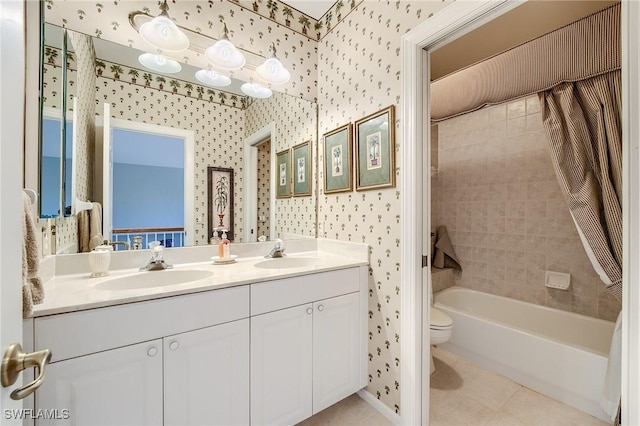 full bathroom featuring tile patterned flooring, vanity, toilet, and tiled shower / bath