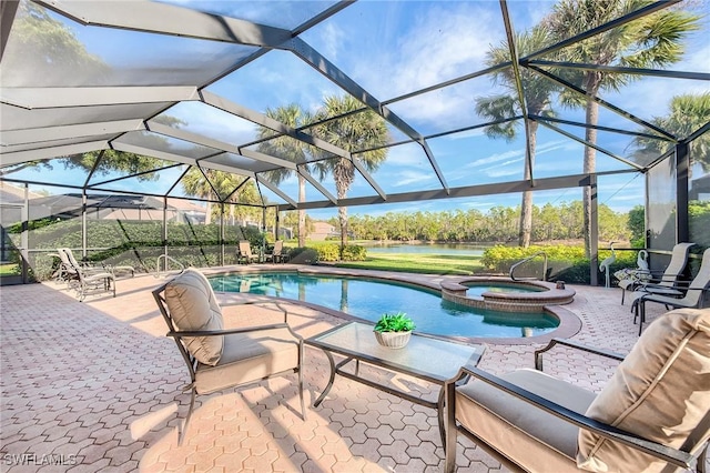 view of pool with an in ground hot tub, glass enclosure, and a patio area