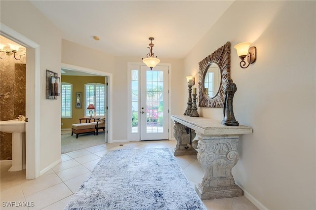 entryway with light tile patterned floors