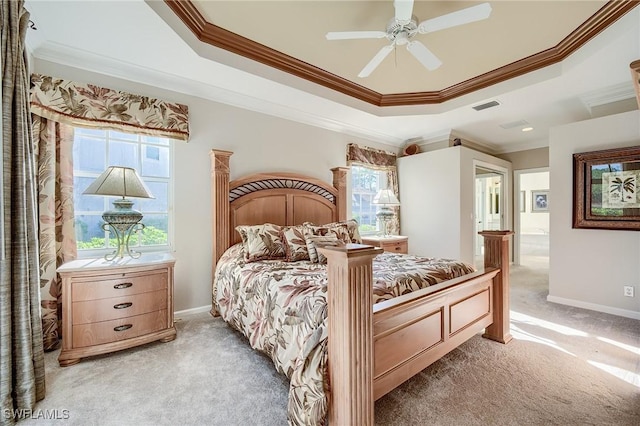 bedroom with carpet, a raised ceiling, and ceiling fan