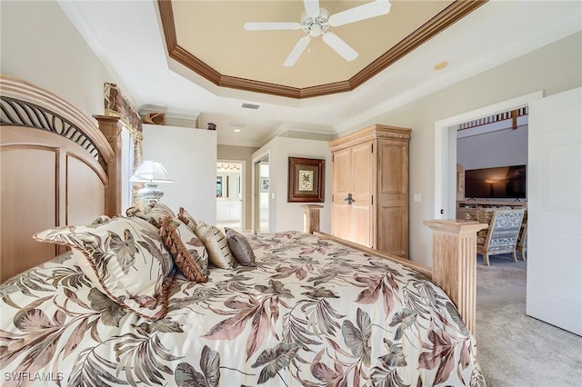 carpeted bedroom featuring ceiling fan, a raised ceiling, and crown molding