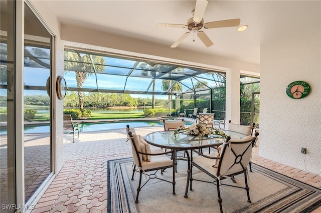 sunroom / solarium with ceiling fan and a wealth of natural light