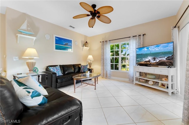 tiled living room with ceiling fan