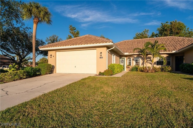 view of front of home with a garage and a front yard