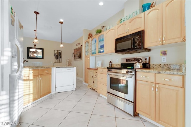 kitchen with light brown cabinetry, light tile patterned floors, white appliances, and pendant lighting