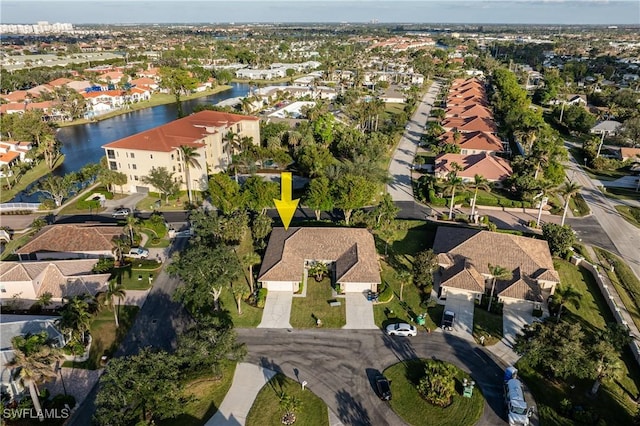 birds eye view of property featuring a water view