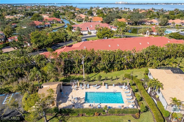 birds eye view of property with a water view