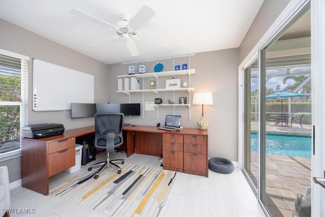 office space with plenty of natural light and ceiling fan