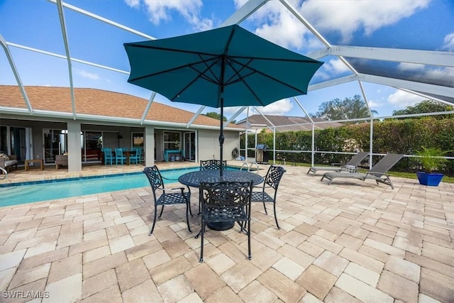 view of swimming pool with a lanai and a patio