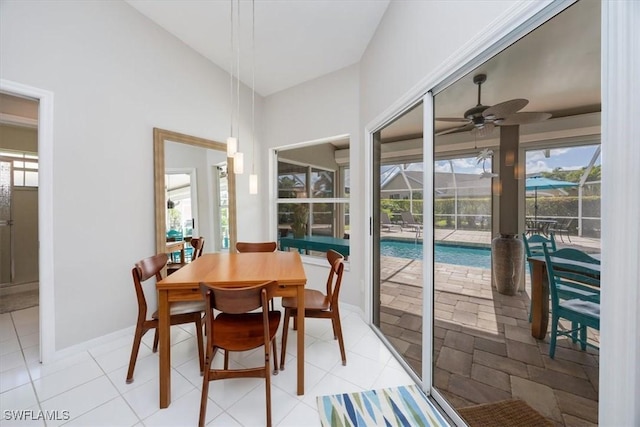 dining space with light tile patterned floors and ceiling fan