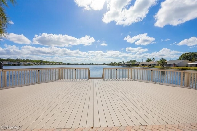 dock area featuring a deck with water view