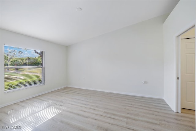 empty room with light hardwood / wood-style floors