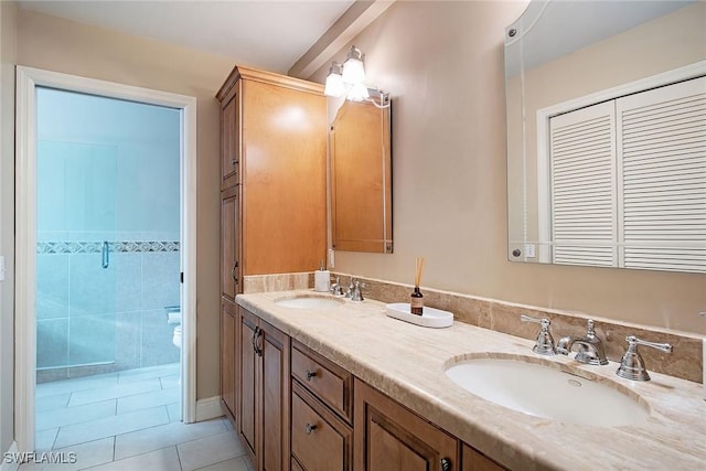 bathroom featuring tile patterned floors, vanity, and toilet